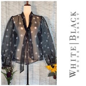 White House Black Market black and white polka-dots mesh see-through blouse.